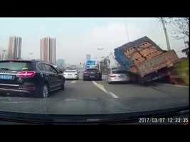 Truck Buries Car Under Load Of Bricks - YouTube